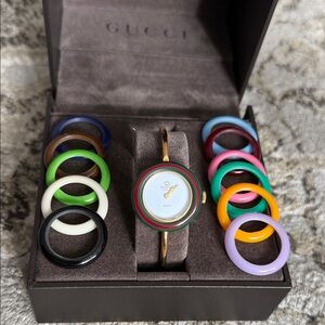 Gucci Women's Gold-Tone Bangle Watch with Multicolor Interchangeable Rings